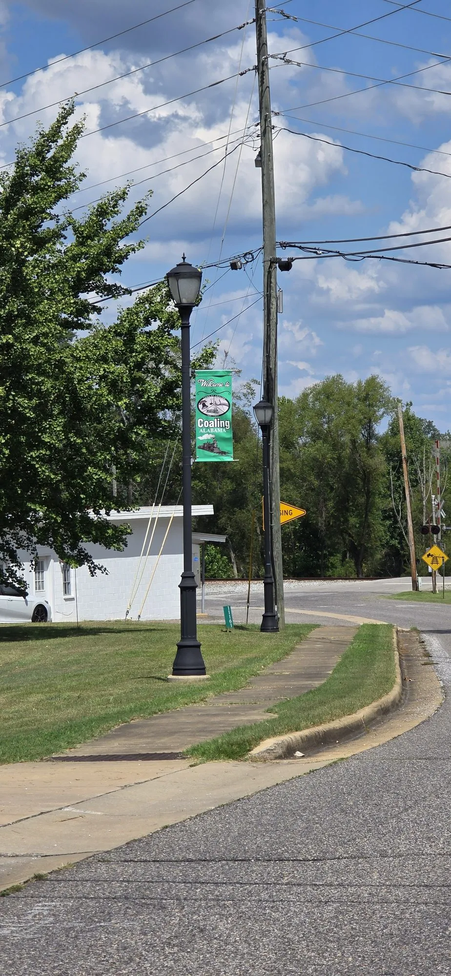A Coaling street banner on a lamp post in town