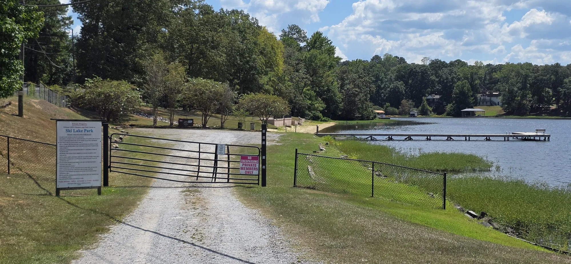 Gated gravel drive down to the Ski Lake Park dock in Lake View