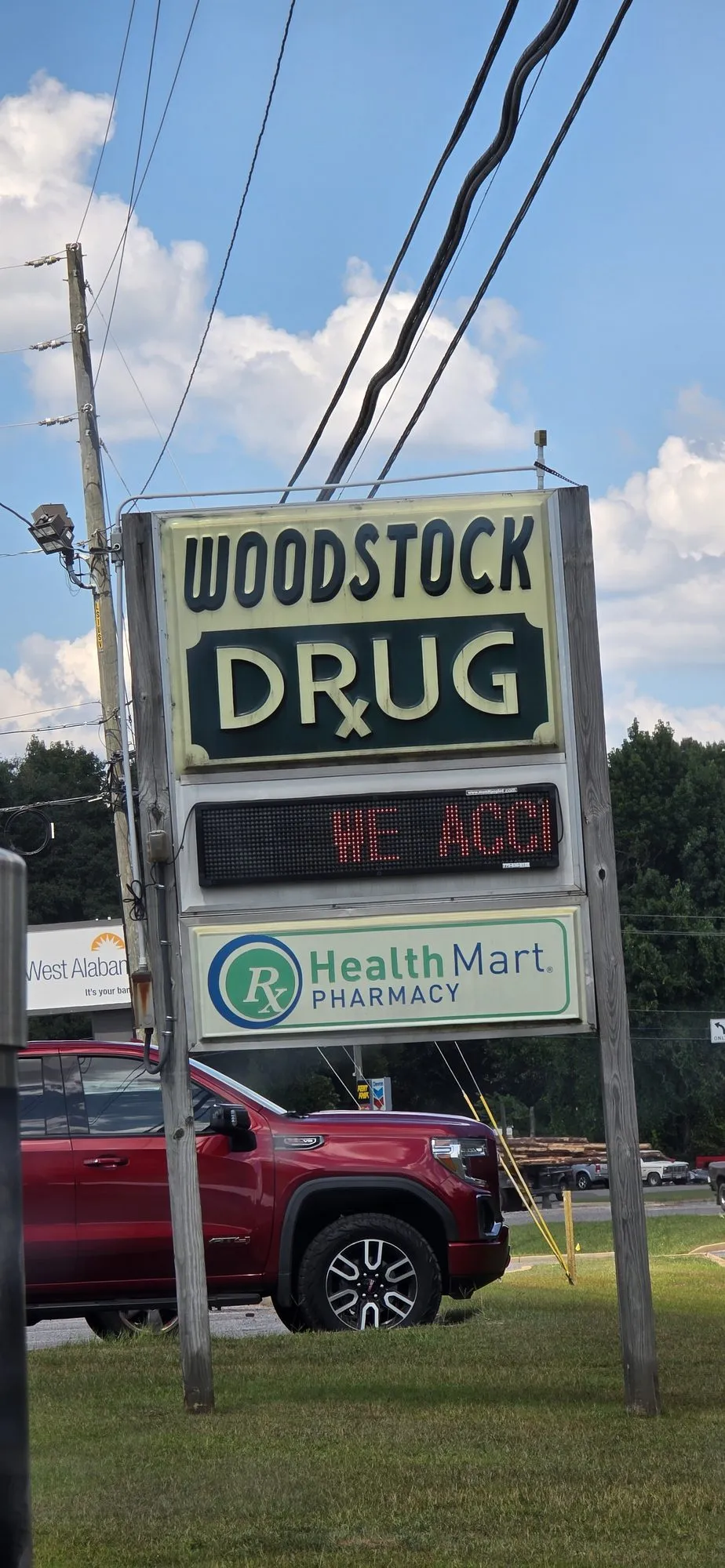 The Woodstock Drug sign on the highway
